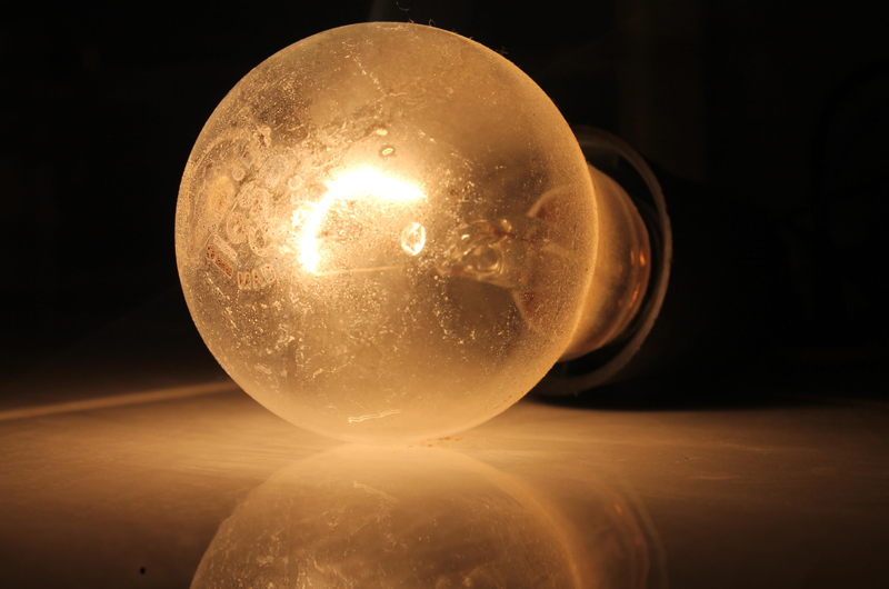 A lit light bulb.
